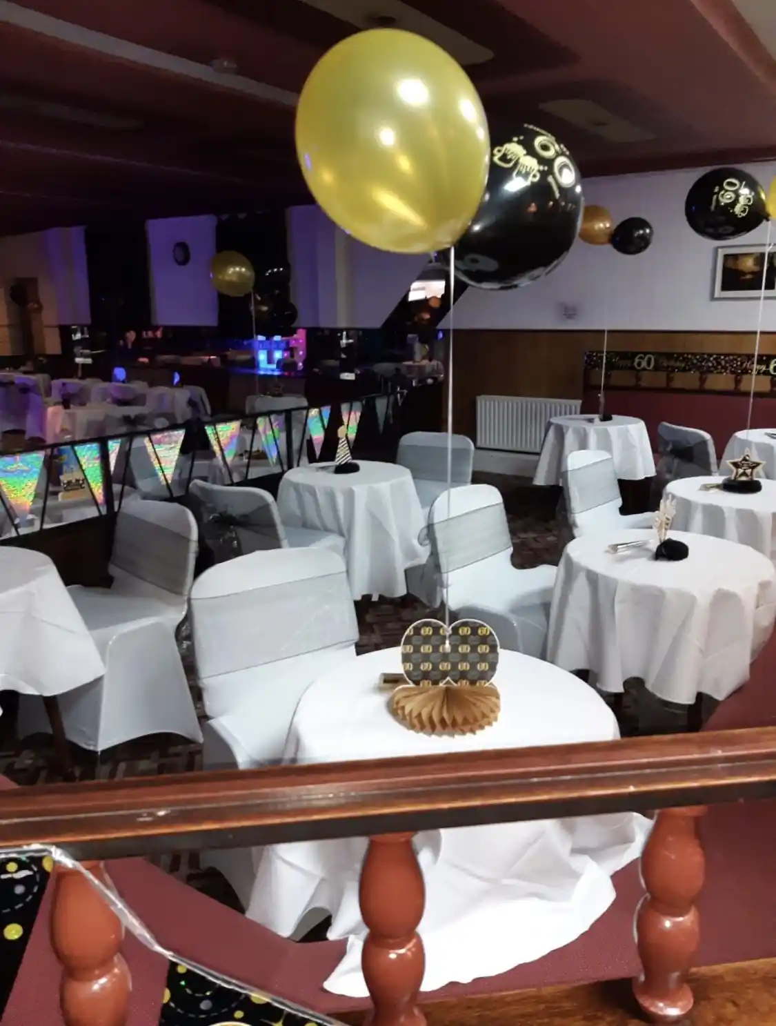 The event space set up for a party with decorations